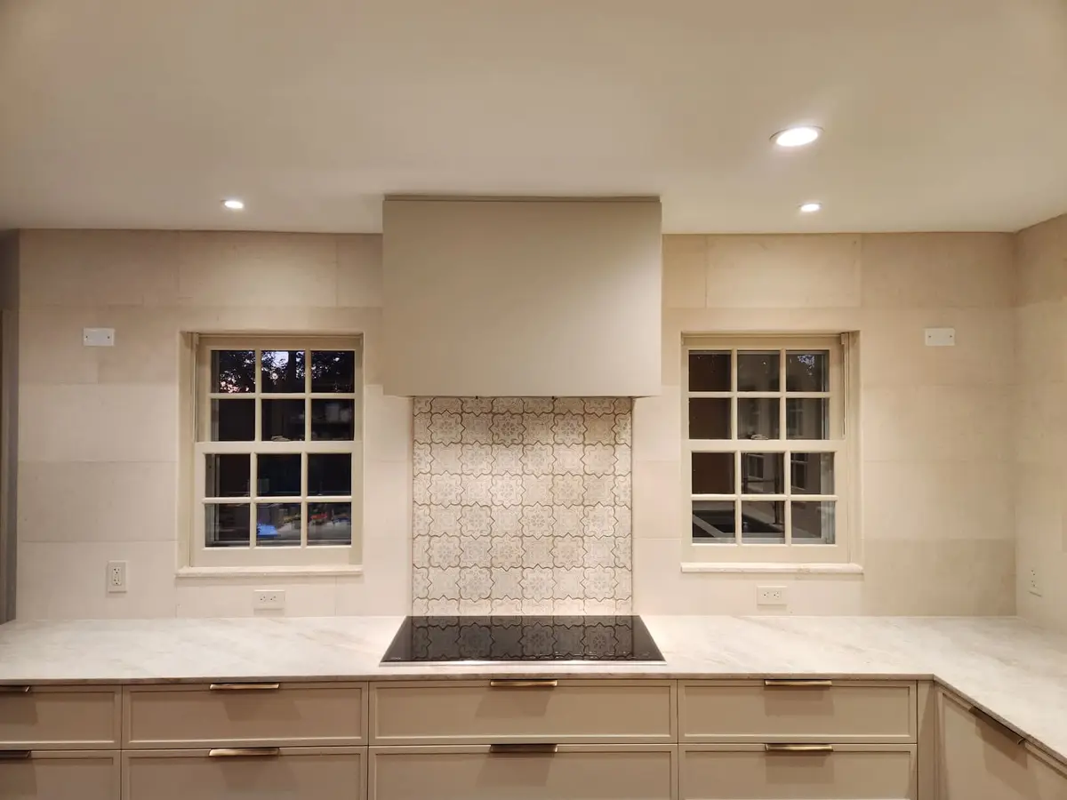 Natural Stone 12x24 in Greenwich CT — 12x24 natural stone tiles with custom design over cooktop.
